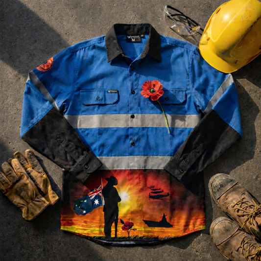 Courage Blue hi-vis work shirt with a sunset design, hard hat, gloves, and boots on a concrete surface