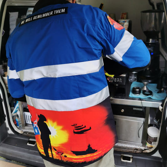 Australian tradie wearing courage blue hi vis workshirt on worksite